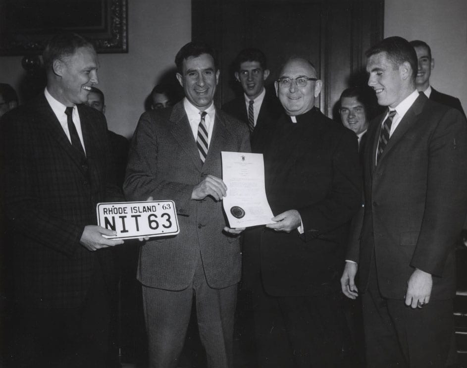 1963 NIT Championship recognition with, from left, Coach Joe Mullaney, Gov. John H. Chafee, Rev. Robert J. Slavin, O.P., and Ray Flynn ’63