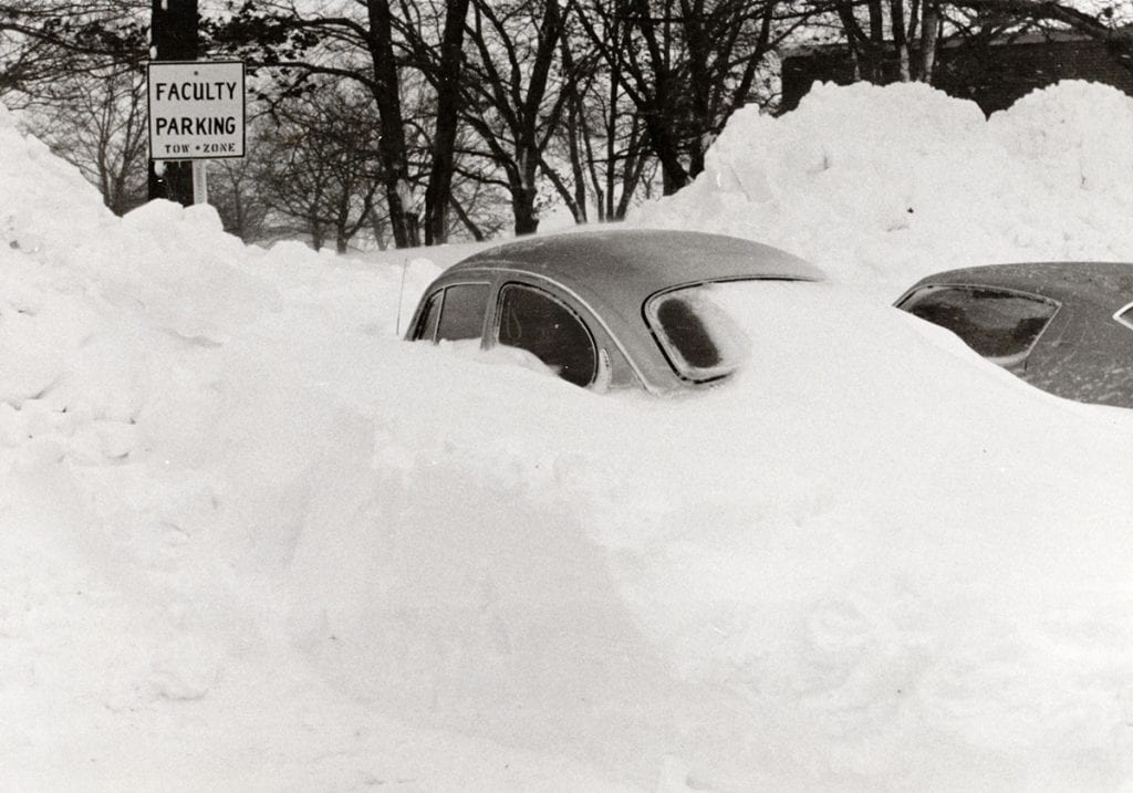 A volkswagon bug buried in snow