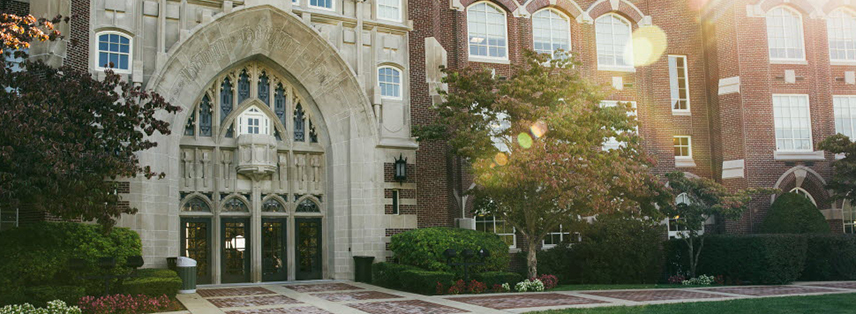 An photo of the entrance to Harkins Hall at dawn
